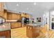 Spacious kitchen with wooden cabinets, granite countertops, and stainless steel appliances at 255 Emerald Lake Dr, Fayetteville, GA 30215