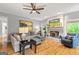 Inviting living room with hardwood floors, brick fireplace, and a comfortable sectional sofa at 255 Emerald Lake Dr, Fayetteville, GA 30215