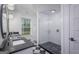 Stylish bathroom with dual sinks, a glass-enclosed shower, and checkerboard tile flooring at 211 Hogan Coweta Rd, Hogansville, GA 30230