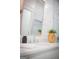 Bright bathroom featuring a marble countertop, vintage faucet, and decorative planter at 211 Hogan Coweta Rd, Hogansville, GA 30230