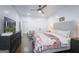 Well-lit bedroom featuring a comfortable bed, modern furniture, and shiplap walls at 211 Hogan Coweta Rd, Hogansville, GA 30230
