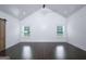 Bright, minimalist bedroom featuring vaulted ceilings and hardwood floors at 211 Hogan Coweta Rd, Hogansville, GA 30230