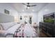 Bright bedroom featuring a cozy bed, modern furniture, and shiplap walls at 211 Hogan Coweta Rd, Hogansville, GA 30230