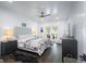 Tranquil bedroom featuring a cozy bed, stylish furniture, and a sliding door to an outdoor area at 211 Hogan Coweta Rd, Hogansville, GA 30230