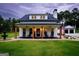 Attractive two-story home with a covered porch and well-maintained yard at 211 Hogan Coweta Rd, Hogansville, GA 30230