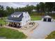 Charming farmhouse-style home featuring a covered porch and separate garage at 211 Hogan Coweta Rd, Hogansville, GA 30230