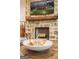 Cozy stone fireplace with wood mantel offering rustic charm and warmth at 211 Hogan Coweta Rd, Hogansville, GA 30230