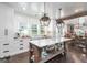 Elegant kitchen featuring a center island, custom cabinetry, and modern lighting at 211 Hogan Coweta Rd, Hogansville, GA 30230