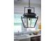 A close-up view of a lantern-style lighting fixture hanging in the kitchen area at 211 Hogan Coweta Rd, Hogansville, GA 30230