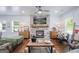 Bright and spacious living room featuring a stone fireplace and lots of natural light at 211 Hogan Coweta Rd, Hogansville, GA 30230