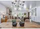 Spacious living room featuring a stone fireplace, beamed ceilings, and lots of natural light at 211 Hogan Coweta Rd, Hogansville, GA 30230