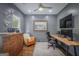 Home office with wood desktop, decor, mounted monitor, and comfortable rolling chair at 211 Hogan Coweta Rd, Hogansville, GA 30230