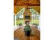 Inviting outdoor area with fireplace and green views at 211 Hogan Coweta Rd, Hogansville, GA 30230