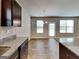 Well-appointed kitchen featuring granite countertops, an island, and modern appliances at 1392 Worcester Trl, Mcdonough, GA 30253