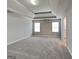 Spacious main bedroom features neutral walls, carpet flooring, and natural light at 1392 Worcester Trl, Mcdonough, GA 30253