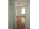 Bright bedroom featuring wood-look floors and a window letting in natural light at 10 Nicole Ct, Covington, GA 30016