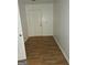 Entryway with wood-look flooring and a white front door at 10 Nicole Ct, Covington, GA 30016