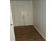 Entryway with wood-look flooring and a white front door at 10 Nicole Ct, Covington, GA 30016