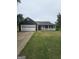 Charming one-story home with a spacious two-car garage and inviting front porch at 10 Nicole Ct, Covington, GA 30016