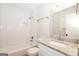 Updated bathroom with white subway tile, granite vanity, and modern fixtures at 1590 Sw Cherry Hill Ln, Conyers, GA 30094