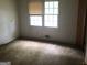 Bedroom with a large window at 2017 Pine Cone Sw Dr, Atlanta, GA 30331