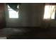 Bedroom with two windows, carpet, and a door at 2017 Pine Cone Sw Dr, Atlanta, GA 30331