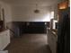 Kitchen with white cabinets and view to second room at 2017 Pine Cone Sw Dr, Atlanta, GA 30331