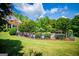 Expansive backyard featuring a well-manicured lawn and a fenced in inground pool area at 1745 Stripling Chapel Rd, Carrollton, GA 30116