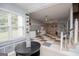 Well-lit finished basement with a large window and a built-in bench at 1745 Stripling Chapel Rd, Carrollton, GA 30116