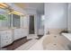 Bathroom with a soaking tub, walk-in shower, double vanity, neutral colors, and natural light at 1745 Stripling Chapel Rd, Carrollton, GA 30116