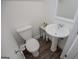 Cozy half bathroom featuring a toilet and pedestal sink at 1745 Stripling Chapel Rd, Carrollton, GA 30116