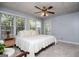 Inviting bedroom featuring soft natural light and a plush king-sized bed at 1745 Stripling Chapel Rd, Carrollton, GA 30116