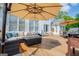 Expansive deck area with comfortable seating, dining set, grill and overhead umbrellas at 1745 Stripling Chapel Rd, Carrollton, GA 30116
