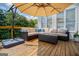 Spacious outdoor deck featuring a seating area, umbrella, and lovely views at 1745 Stripling Chapel Rd, Carrollton, GA 30116
