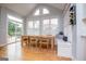 Bright dining area featuring a large table, bench seating, and sliding glass doors to a deck at 1745 Stripling Chapel Rd, Carrollton, GA 30116