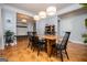 Formal dining space featuring hardwood floors, stylish pendant lighting, and wainscoting, ideal for entertaining at 1745 Stripling Chapel Rd, Carrollton, GA 30116