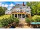 Large 2 story home with wooden deck, covered patio, in ground pool, and mature trees at 1745 Stripling Chapel Rd, Carrollton, GA 30116