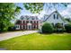 Charming two-story brick home featuring a well-manicured lawn and a circular driveway, enhancing its curb appeal at 1745 Stripling Chapel Rd, Carrollton, GA 30116