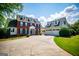 Charming brick home with black shutters, a covered entryway, and a manicured lawn in a suburban setting at 1745 Stripling Chapel Rd, Carrollton, GA 30116