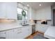 Bright kitchen showcasing white cabinets, marble backsplash, stainless steel appliances, and plenty of natural light at 1745 Stripling Chapel Rd, Carrollton, GA 30116
