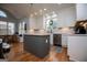 Beautiful kitchen featuring white cabinets, granite countertops, stainless appliances and eat-in breakfast nook at 1745 Stripling Chapel Rd, Carrollton, GA 30116