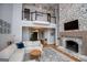 Bright living room boasts high ceilings, stone fireplace, open staircase, and hardwood floors, perfect for relaxing or entertaining at 1745 Stripling Chapel Rd, Carrollton, GA 30116