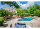 In-ground pool, pool side seating, patio, and steps leading up to a wooden deck at 1745 Stripling Chapel Rd, Carrollton, GA 30116