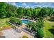 Pool area with surrounding trees for privacy and greenery at 1745 Stripling Chapel Rd, Carrollton, GA 30116