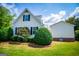 Home exterior featuring manicured shrubs and landscaping, enhancing the property's curb appeal and overall charm at 1745 Stripling Chapel Rd, Carrollton, GA 30116