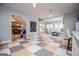 Spacious recreation room featuring colorful floor tiles and a cozy lounge area with a stone fireplace at 1745 Stripling Chapel Rd, Carrollton, GA 30116
