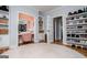 Walk-in closet with a vanity area, custom shelving for shoes and clothes, and a round area rug at 1745 Stripling Chapel Rd, Carrollton, GA 30116