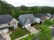Aerial view of homes in a suburban neighborhood with mature trees at 1144 Simonton Hill Ct, Lawrenceville, GA 30045