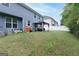Residential backyard featuring a large lawn area, perfect for outdoor activities and gatherings at 1144 Simonton Hill Ct, Lawrenceville, GA 30045