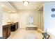 Bright and spacious bathroom with double vanity, shower, and a relaxing ambiance at 1144 Simonton Hill Ct, Lawrenceville, GA 30045